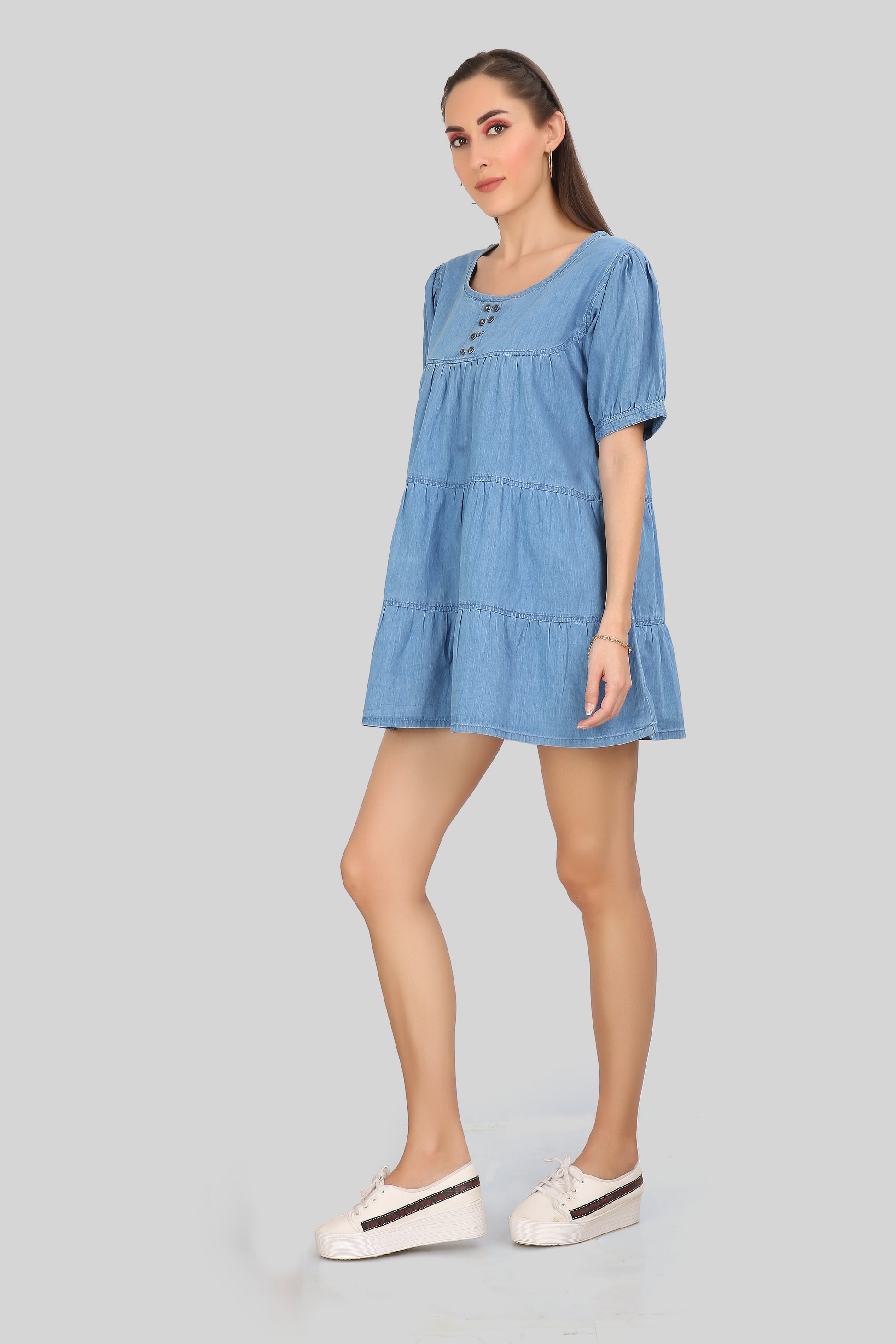 Side view of Women’s Tiered Light Blue Denim Dress highlighting the tiered design and puff sleeves.