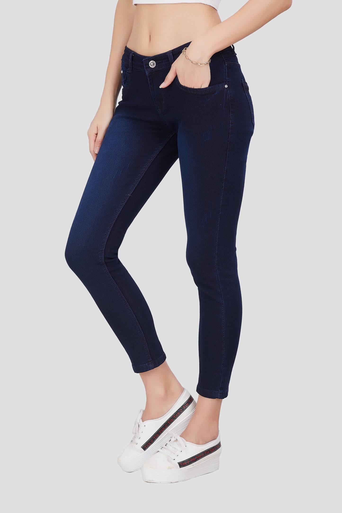 Left side view of Cefalu®️ Women’s Dark Blue Skinny Fit Jeans, emphasizing the skinny fit and light fade wash.