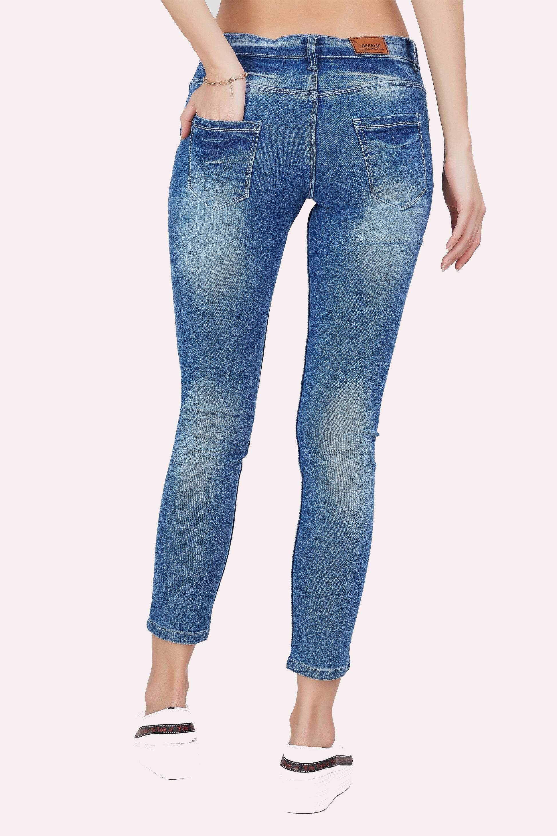 Back view of Cefalu®️ Women’s Light Blue Slim Fit Jeans, featuring the mid-rise fit and overall design.