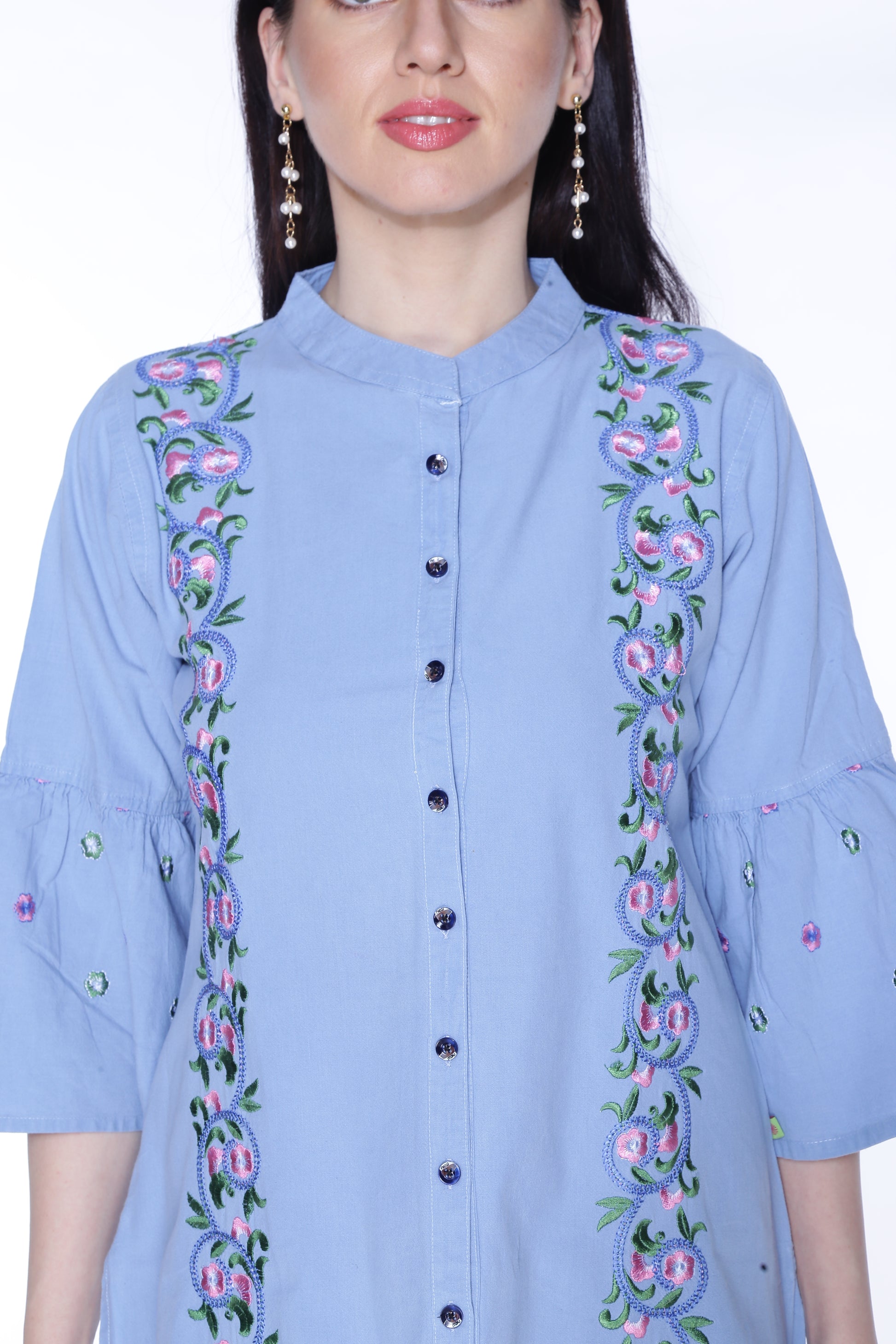 Closeup of Cefalu®️ Women's Light Blue Floral Print Denim Kurti, highlighting the floral print and intricate embroidery details.