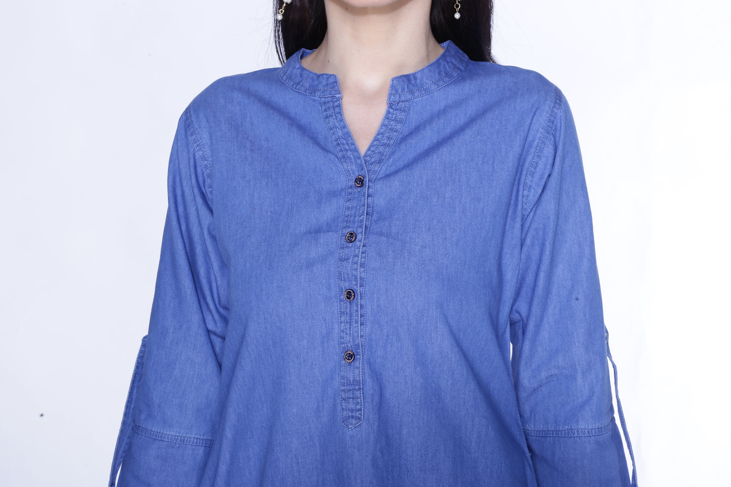 Closeup of Cefalu®️ Women's Light Blue Denim Kurti fabric, highlighting the soft cotton blend texture and solid color.