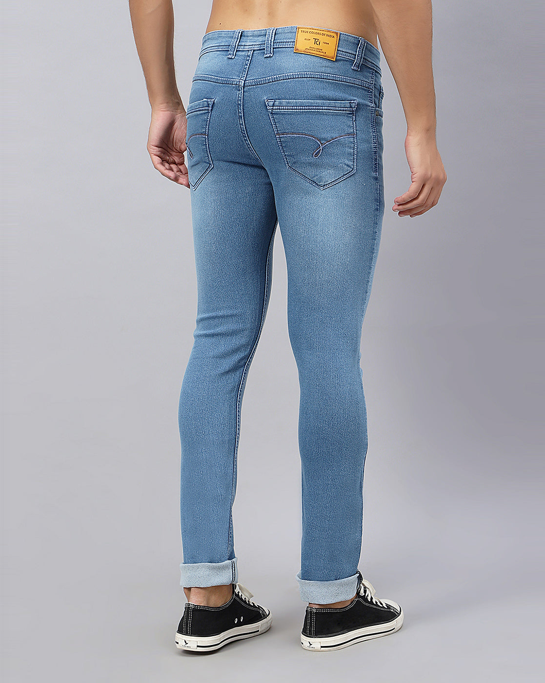 Back view of True Colors of India®️ (TCI) Men’s Light Blue Slim Fit Jeans, featuring the mid-rise fit and distinctive pocket design.