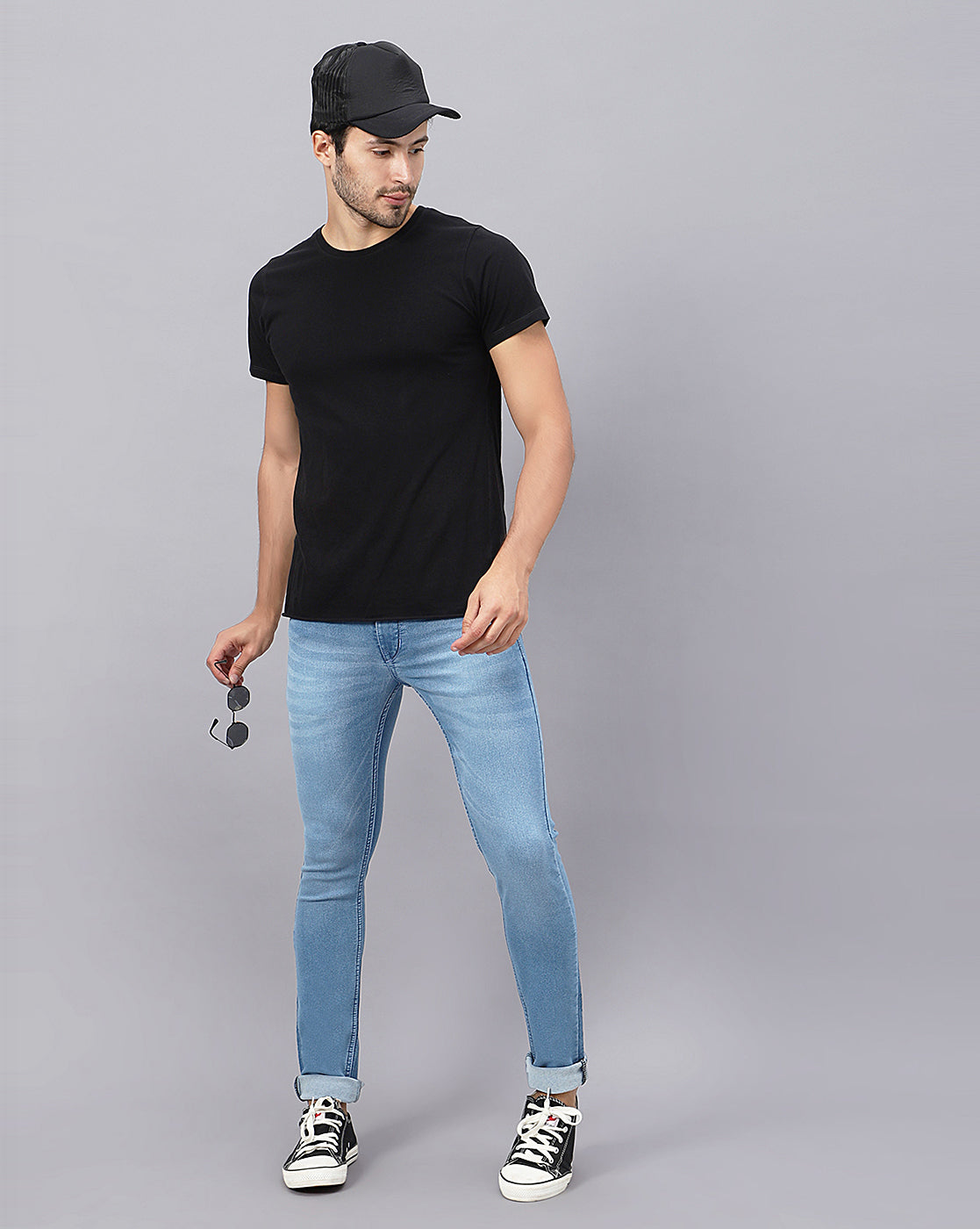 Full model view wearing True Colors of India®️ (TCI) Men’s Light Blue Slim Fit Jeans, demonstrating the overall fit and style of the jeans.