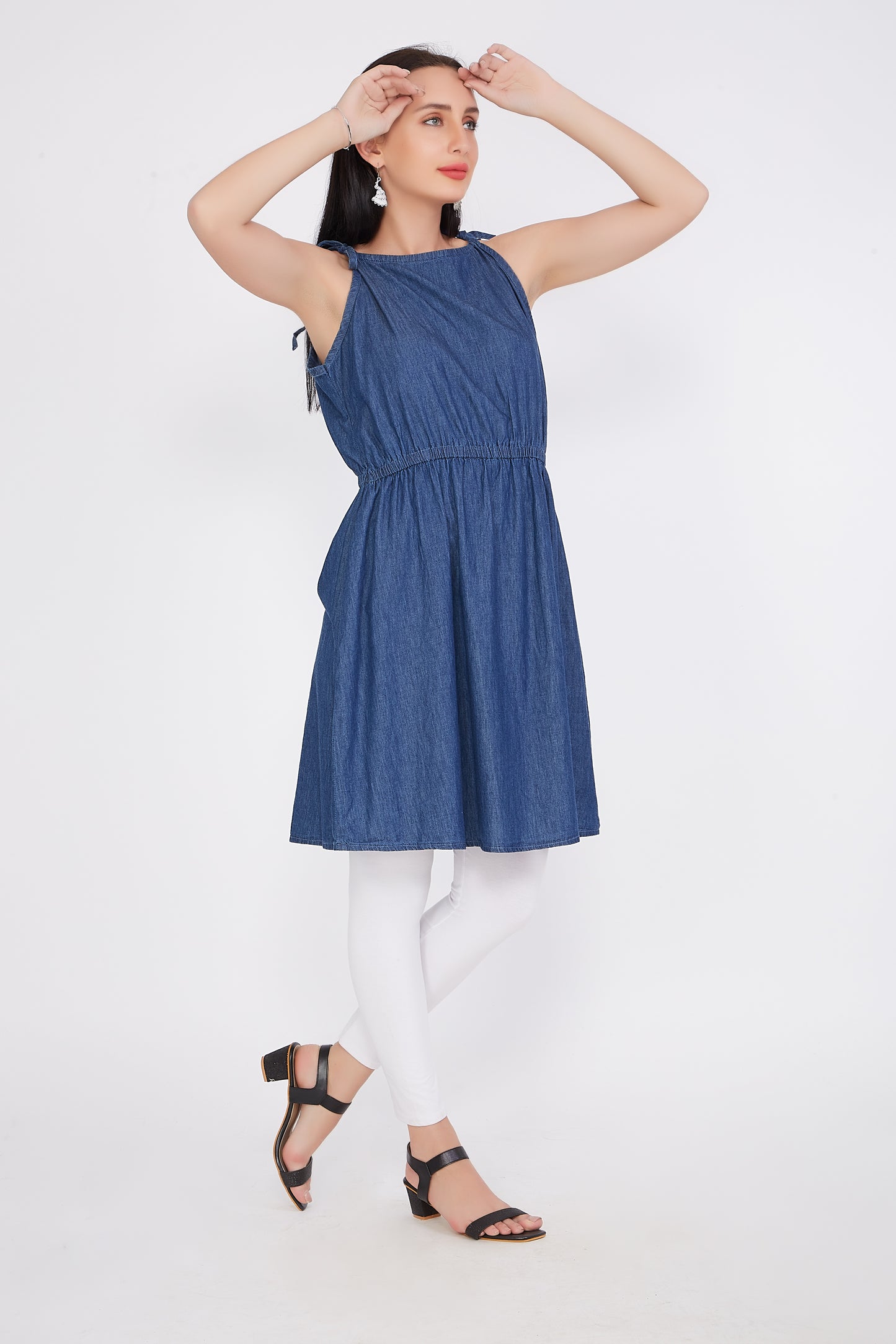 Model wearing Cefalu®️ Women’s Fit and Flare Blue Denim Dress, demonstrating the fit, noodle straps, and knee length in a stylish setting.