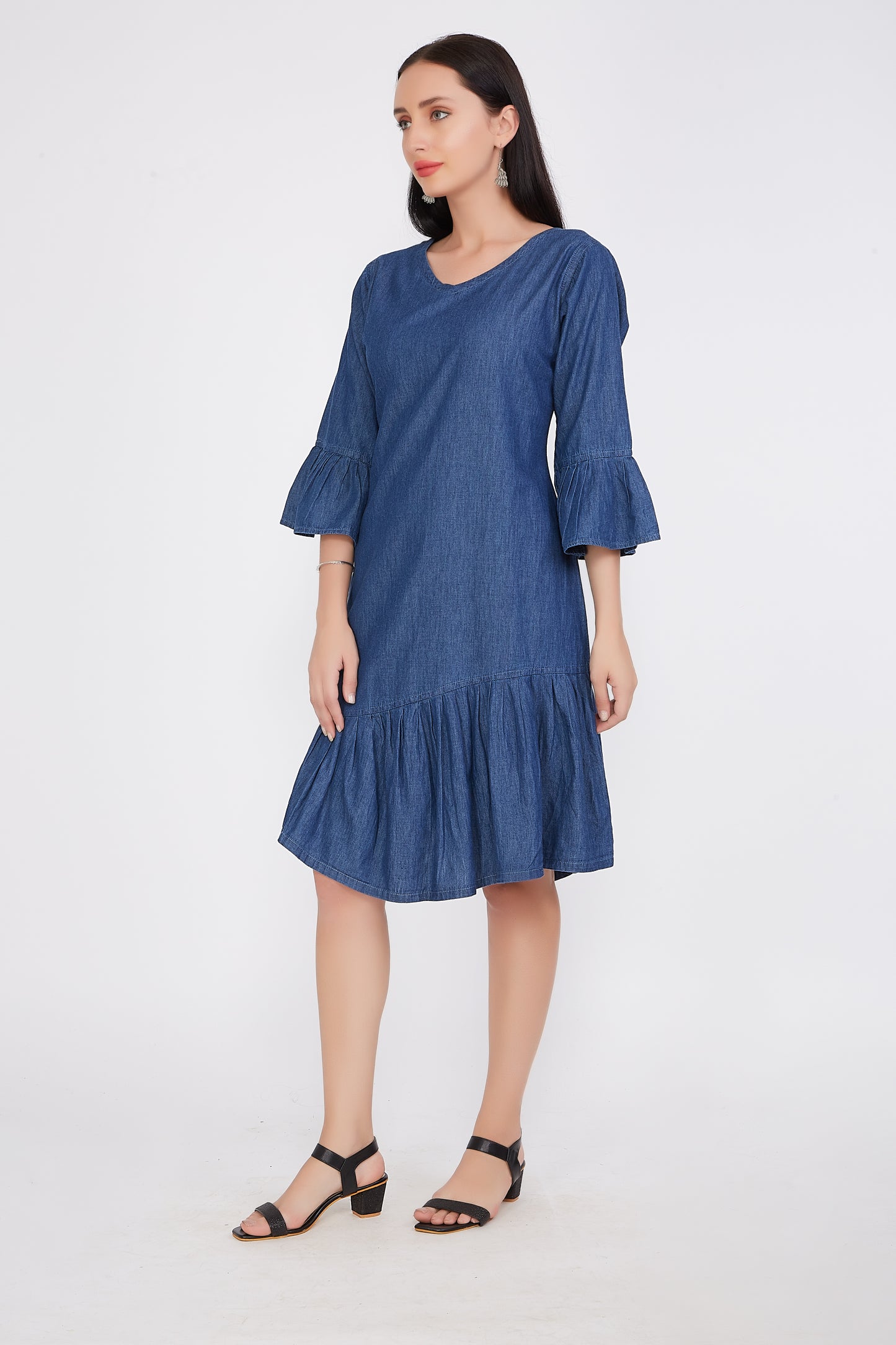 Model wearing Cefalu®️ Women’s A-Line Blue Denim Dress, demonstrating the stylish design, knee length, and bell sleeves in a fashionable setting.