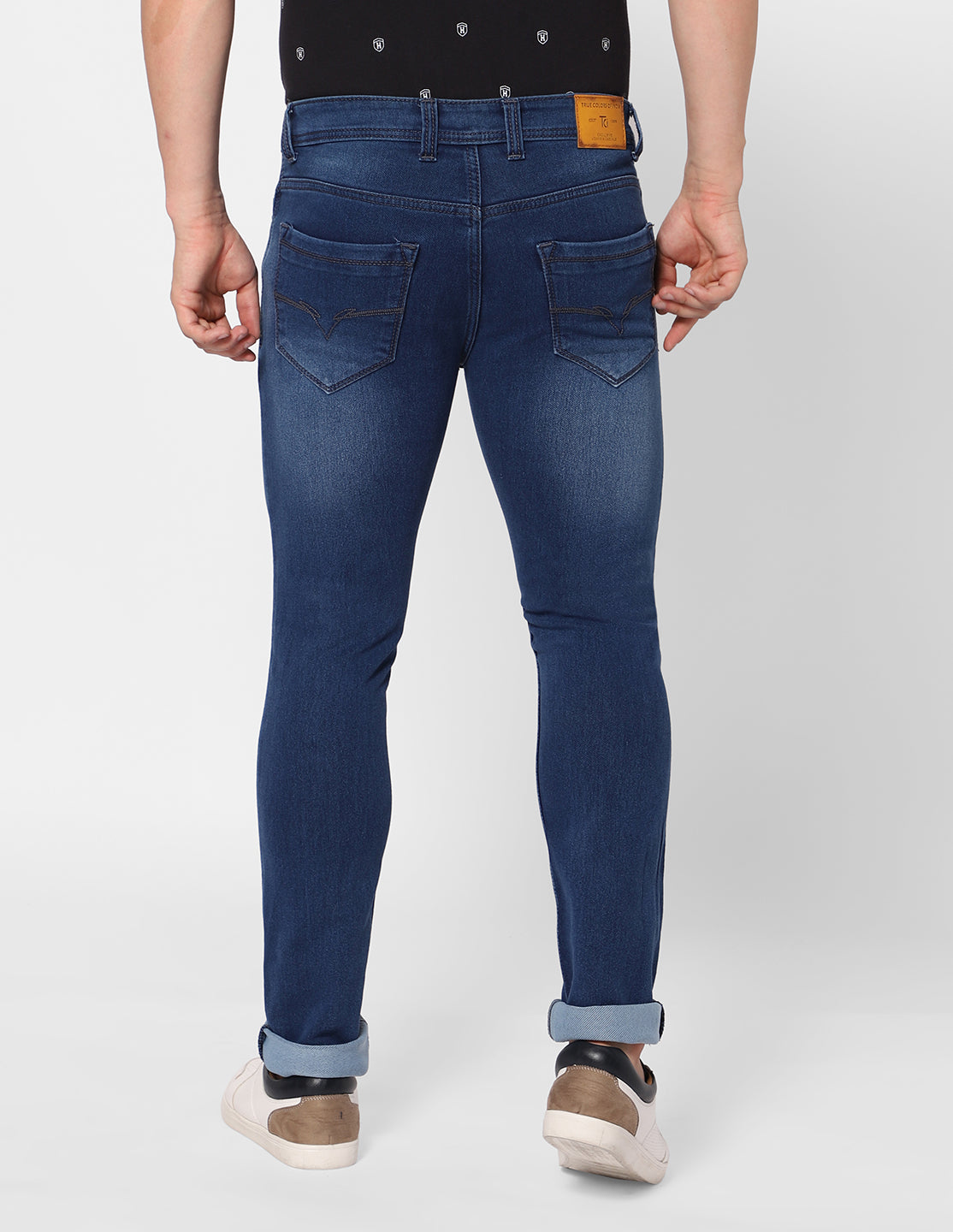 Back view of TCI Men’s Dark Blue Jeans, featuring the back pockets and overall fit.