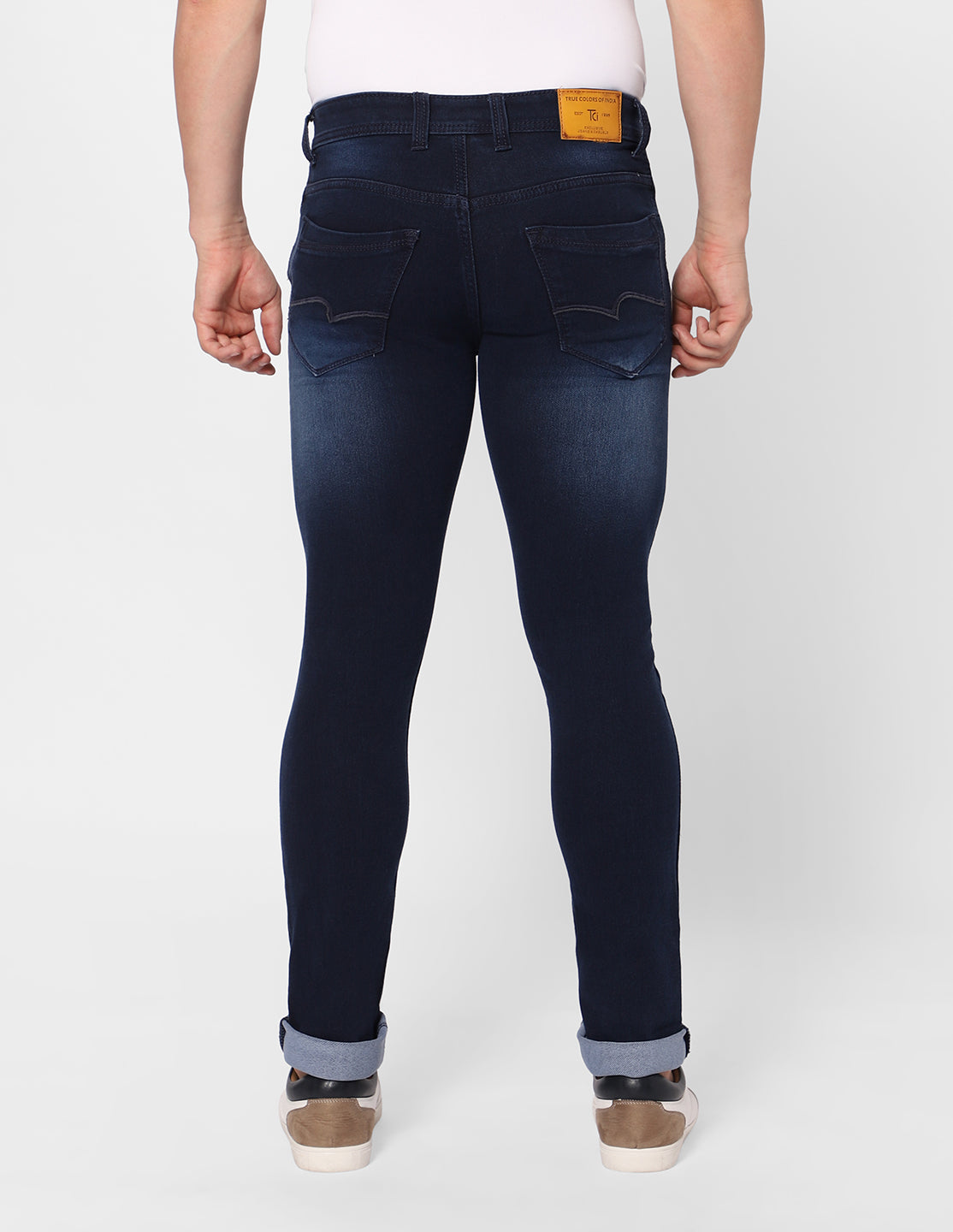 Back view of TCI Men’s Dark Indigo Jeans, showing the back pockets and the overall fit.