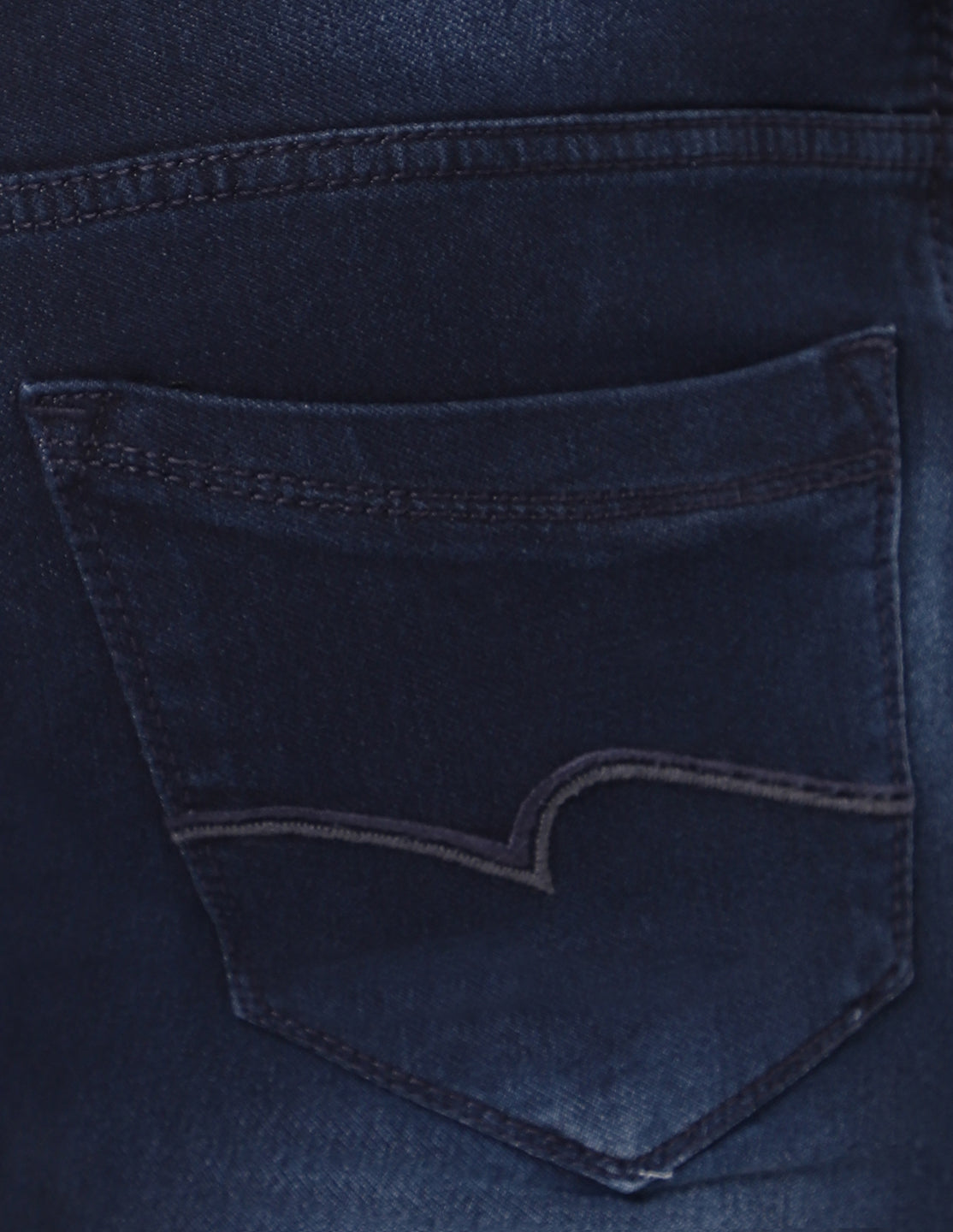 Close-up of the back pocket on TCI Men’s Dark Indigo Jeans, highlighting the stitching and practical design.