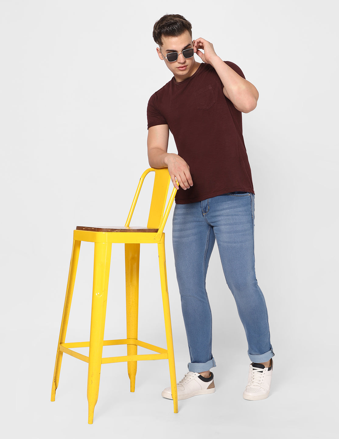 Man Wearing TCI Slim Fit Light Blue Denim Jeans in Casual Setting