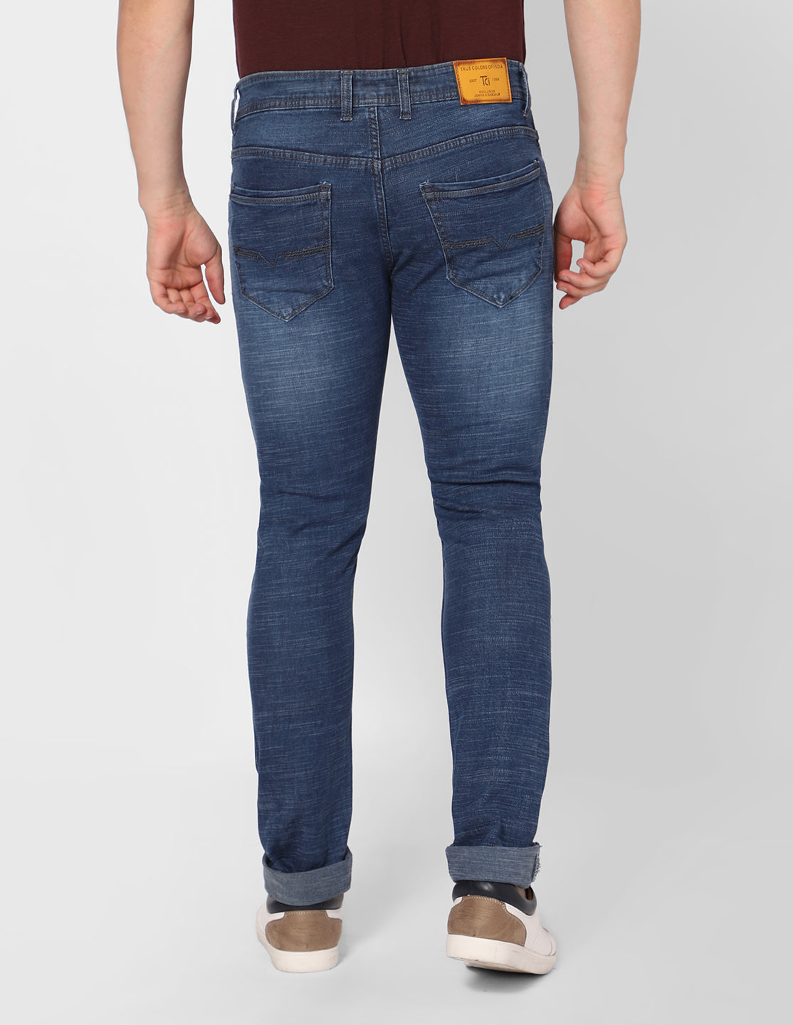 Back view of TCI Men's Stretchable Dark Blue Denim Jeans featuring the slim fit and durable denim fabric.