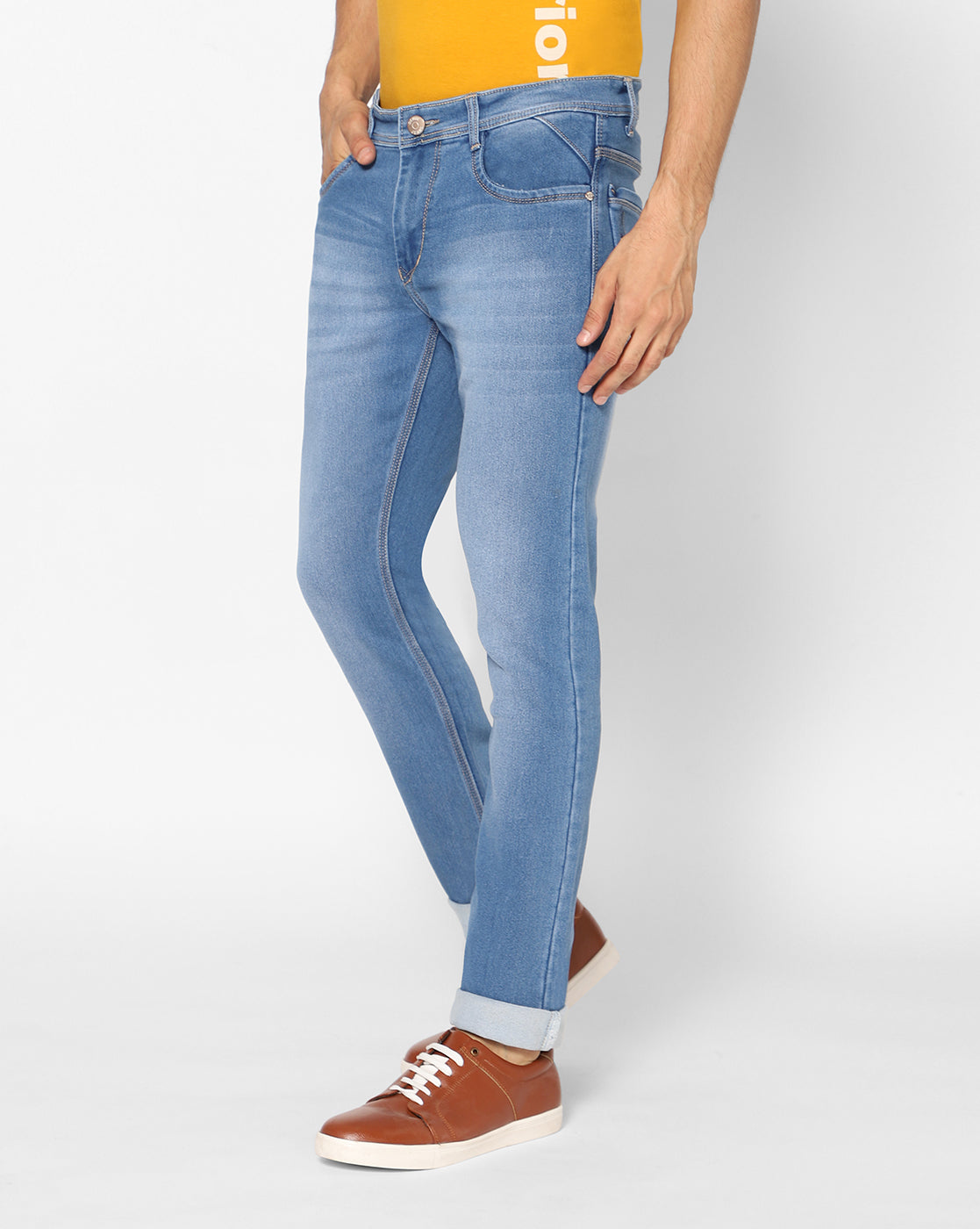 Side view of TCI Men’s Light Blue Stretchable Jeans, highlighting the sleek profile, mild distressing, and regular fit. The jeans feature a comfortable stretchable fabric and functional side pockets.