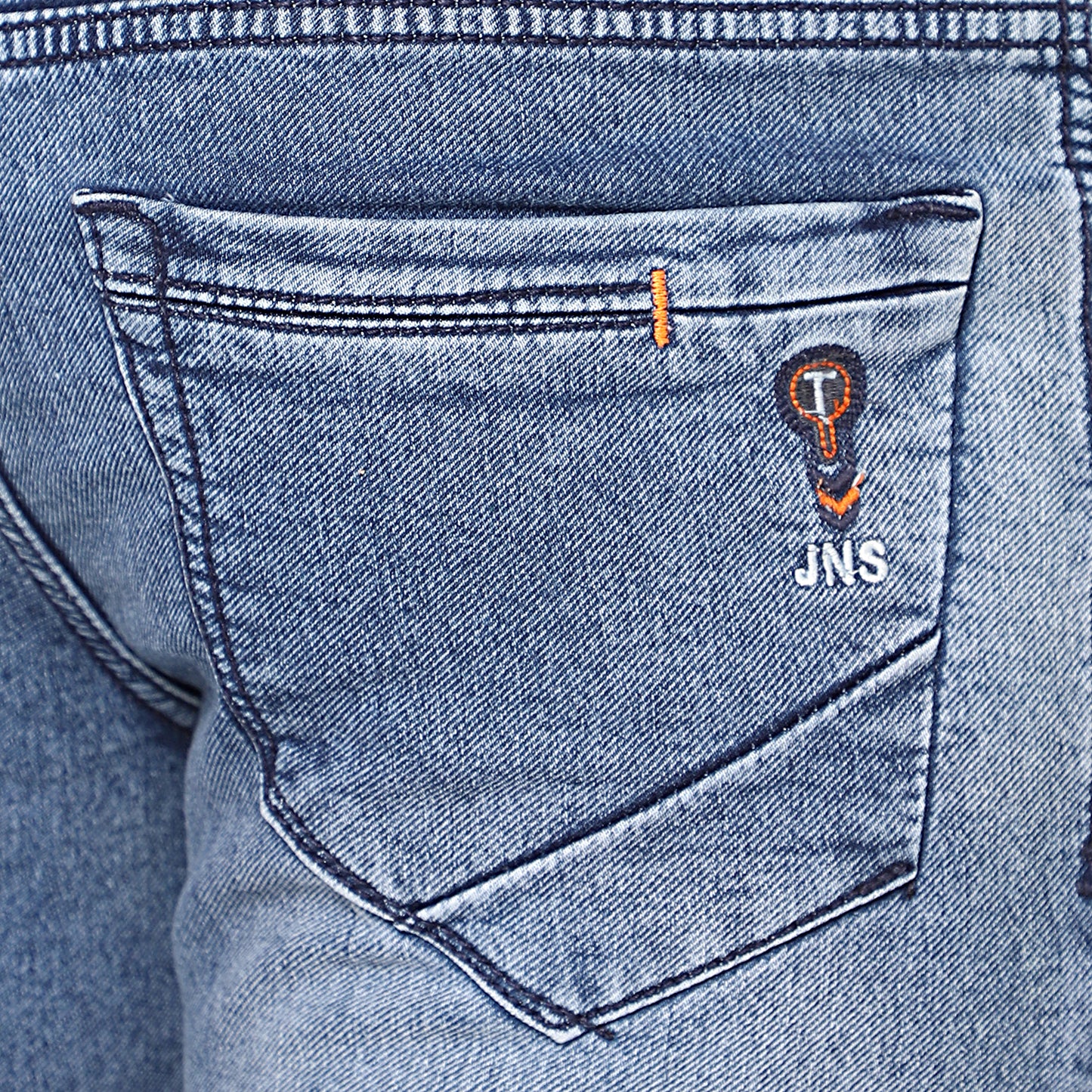 Close-up of high-quality stretchable denim fabric of TCI Mid Blue Jeans, highlighting its durability and flexibility.