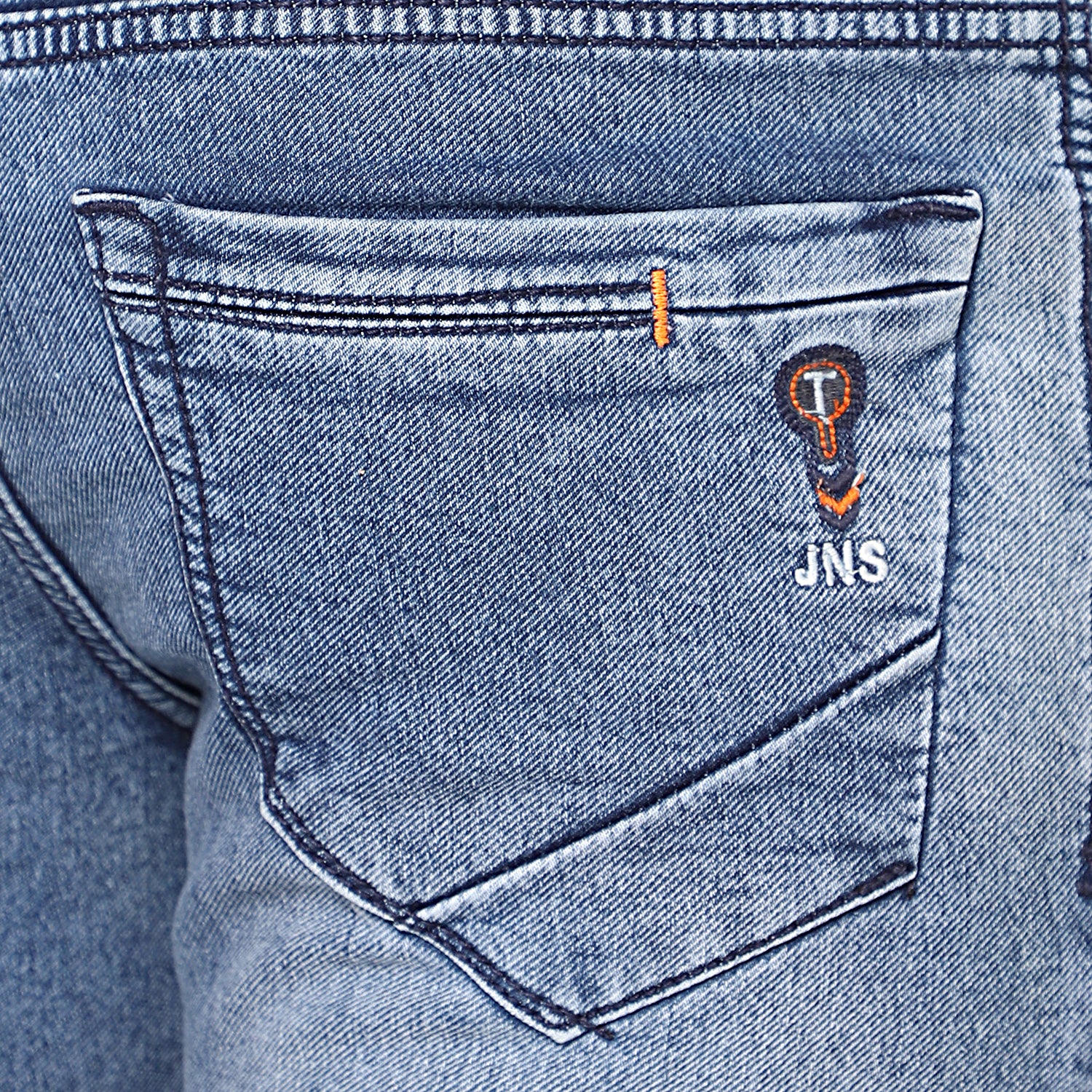 Close-up of high-quality stretchable denim fabric of TCI Mid Blue Jeans, highlighting its durability and flexibility.