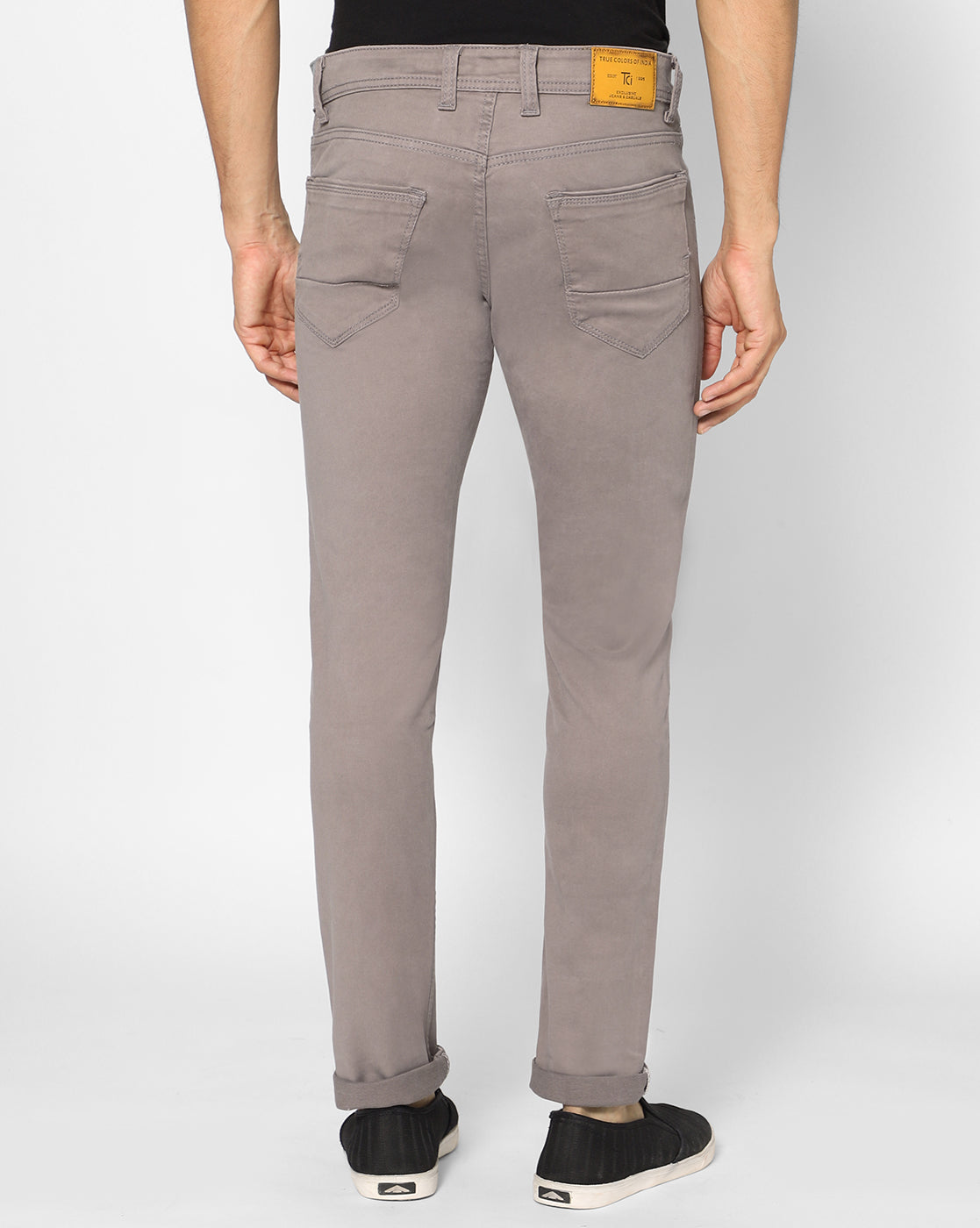 Back view of TCI Men’s Aish Grey Cotton Jeans highlighting the comfortable pockets and overall fit.