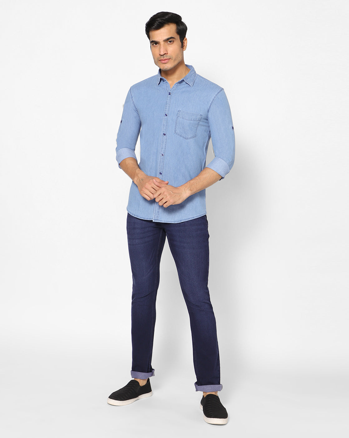 Full model view of TCI Men’s Light Blue Cotton Denim Shirt styled with casual pants, demonstrating the shirt’s regular fit, spread collar, and classic design.