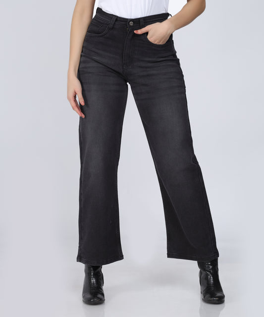 Cefalu Women’s Relaxed Fit Wide Leg Black Jeans with whiskered detailing, displayed against a Grey background.