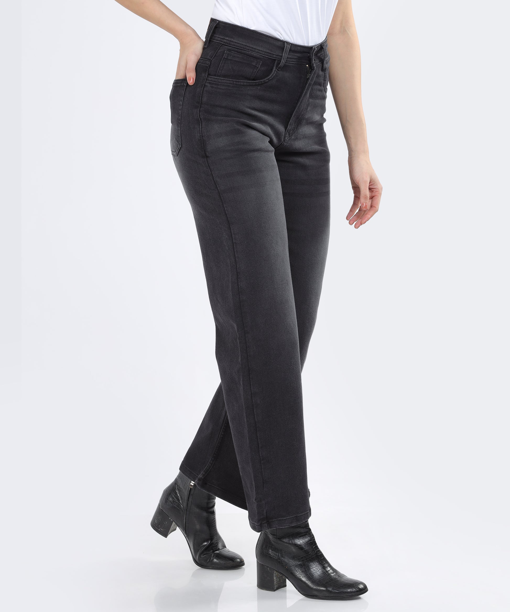 side view of the whiskered detailing on Cefalu Women’s Black Jeans, emphasizing modern style.