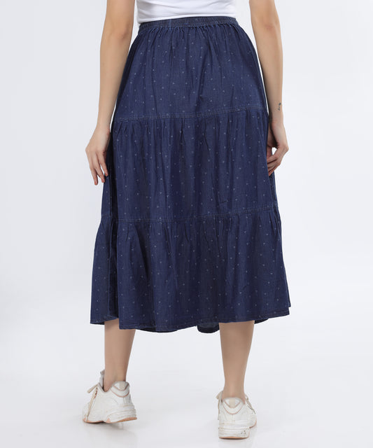 Back view of the Cefalu Women’s Denim Skirt in blue, showing the tiered design and calf-length fit.
