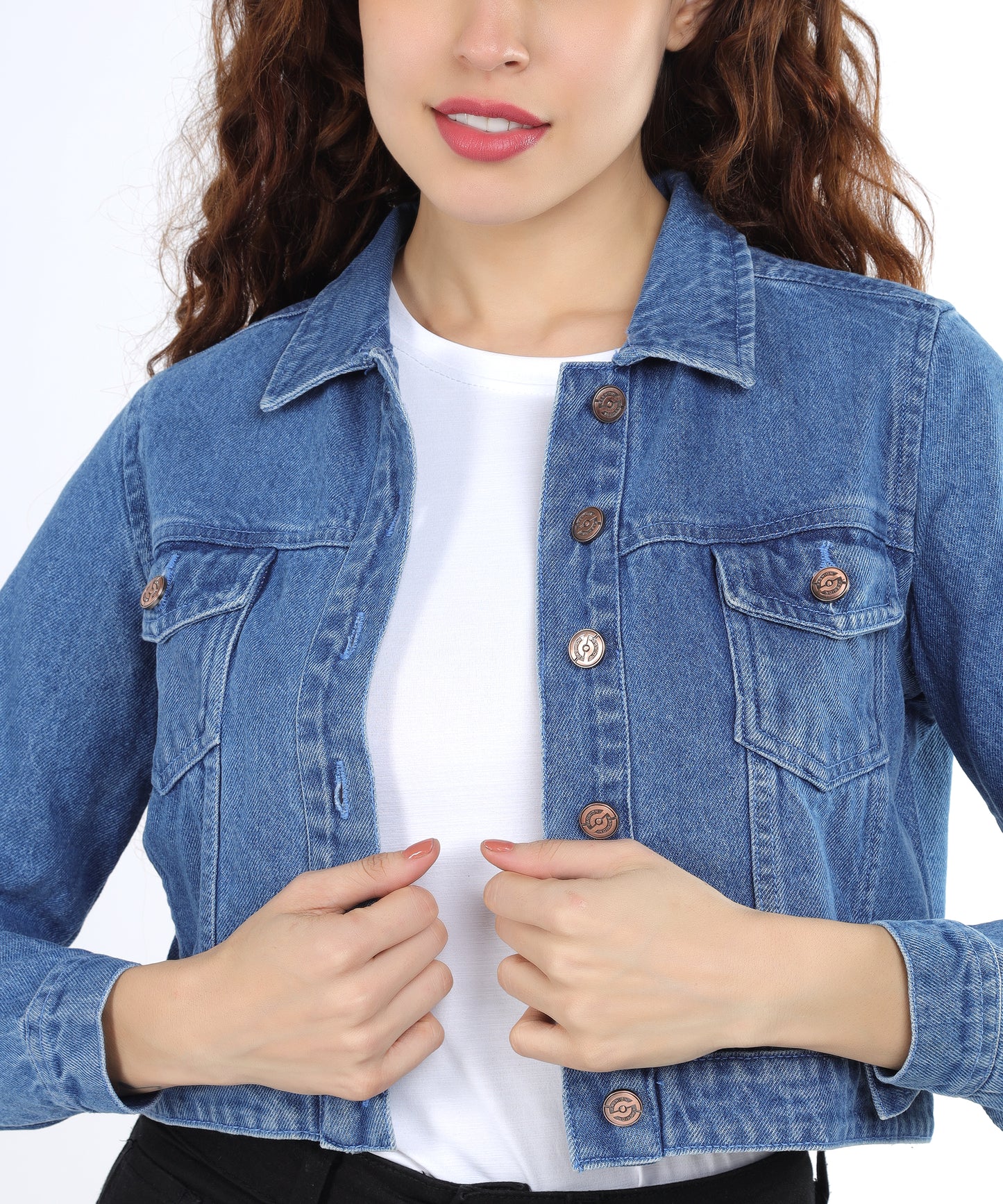 Close-up of the flap pockets & button on the Cefalu Women’s Light Blue Denim Jacket.