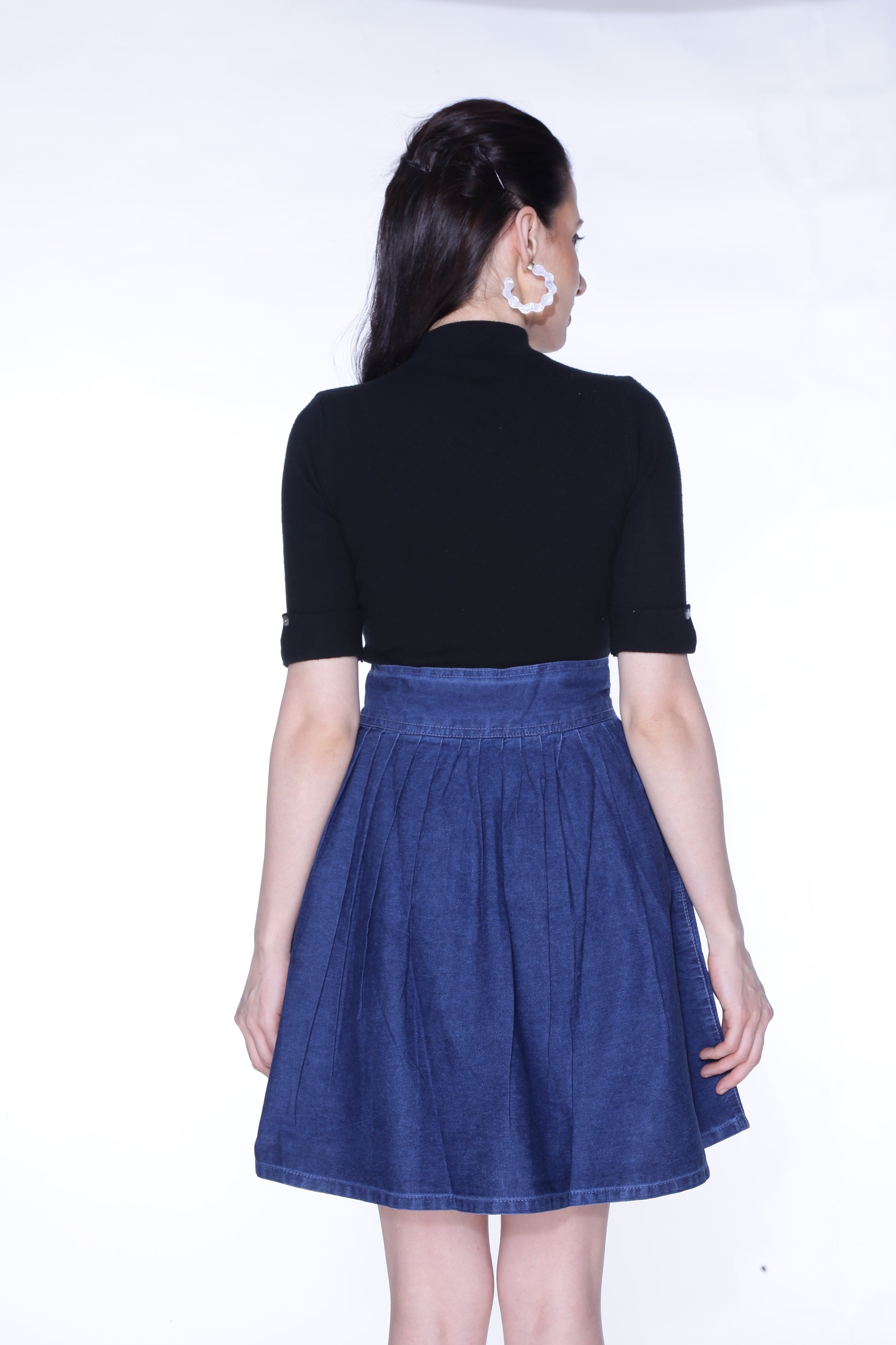 Back view of Cefalu®️ Women’s Dark Blue Denim Mini Skirt, highlighting the rich dark blue color and simple, elegant design.