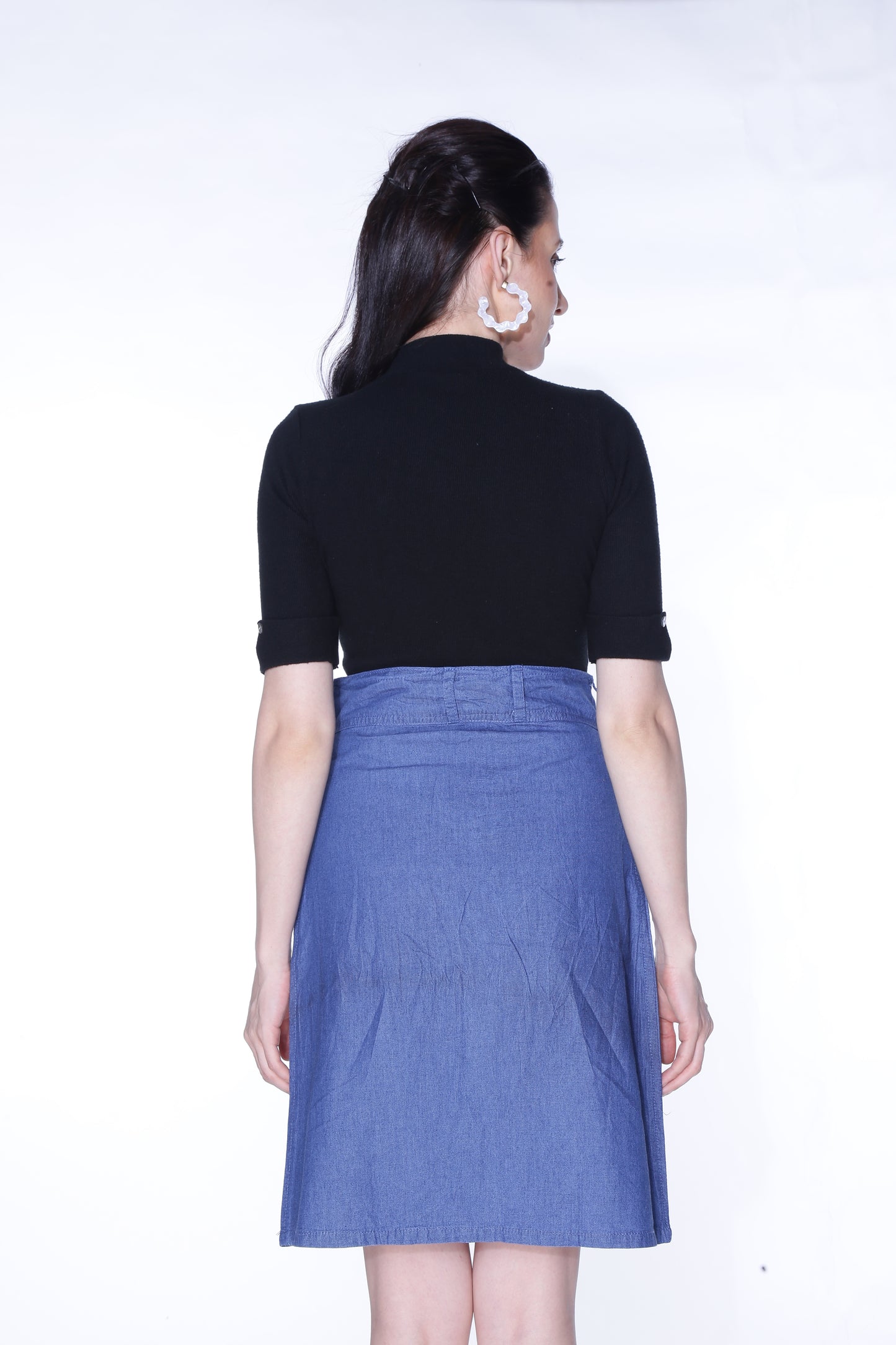 Back view of Cefalu®️ Women’s Blue Denim Mini Skirt, showing off the classic blue denim and sleek, minimalist design.