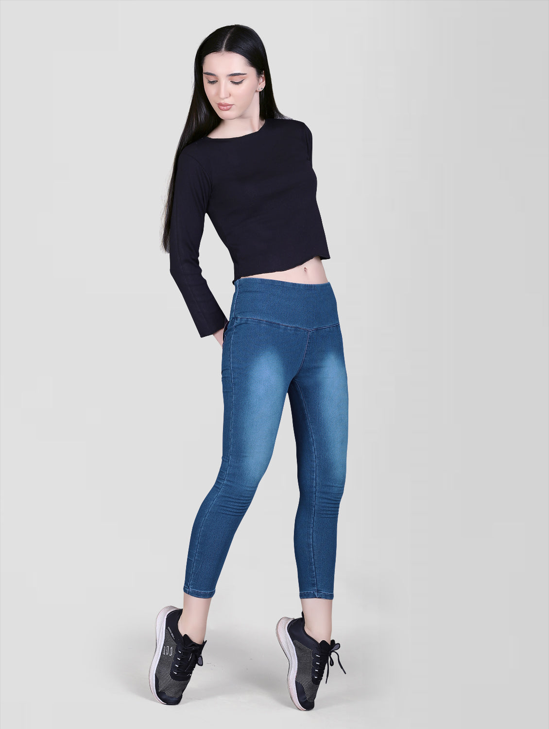 Model wearing Cefalu Women’s Blue Denim Lycra Jeggings – showcasing the fit and style from a full-body perspective.