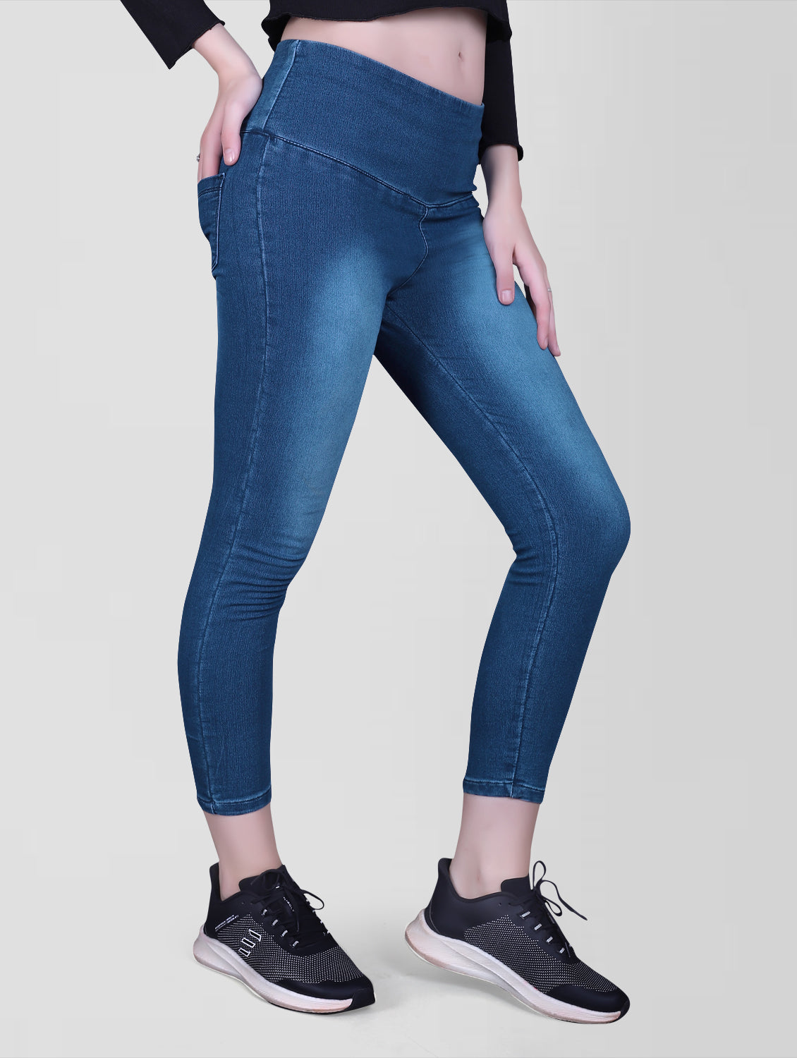 Cefalu Women’s Blue Denim Lycra Jeggings – Side view demonstrating the slim fit and broad belt.