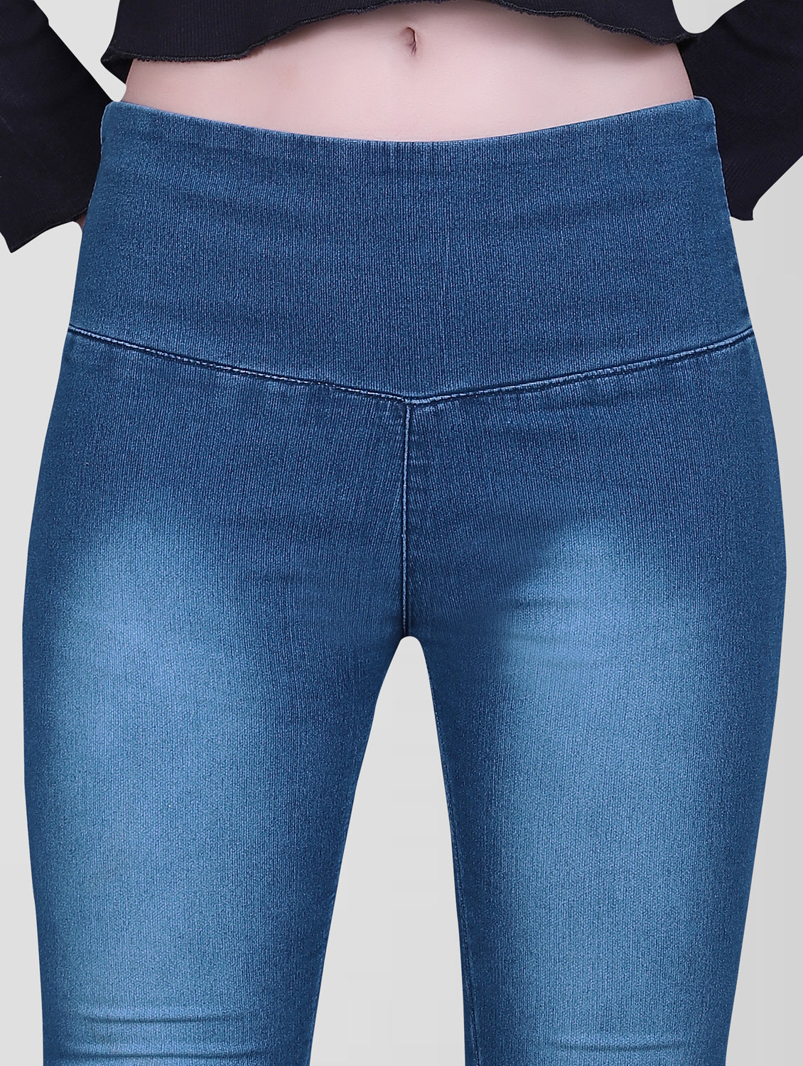 Close-up of Cefalu Women’s Blue Jeggings waistband, featuring a broad belt for added comfort.