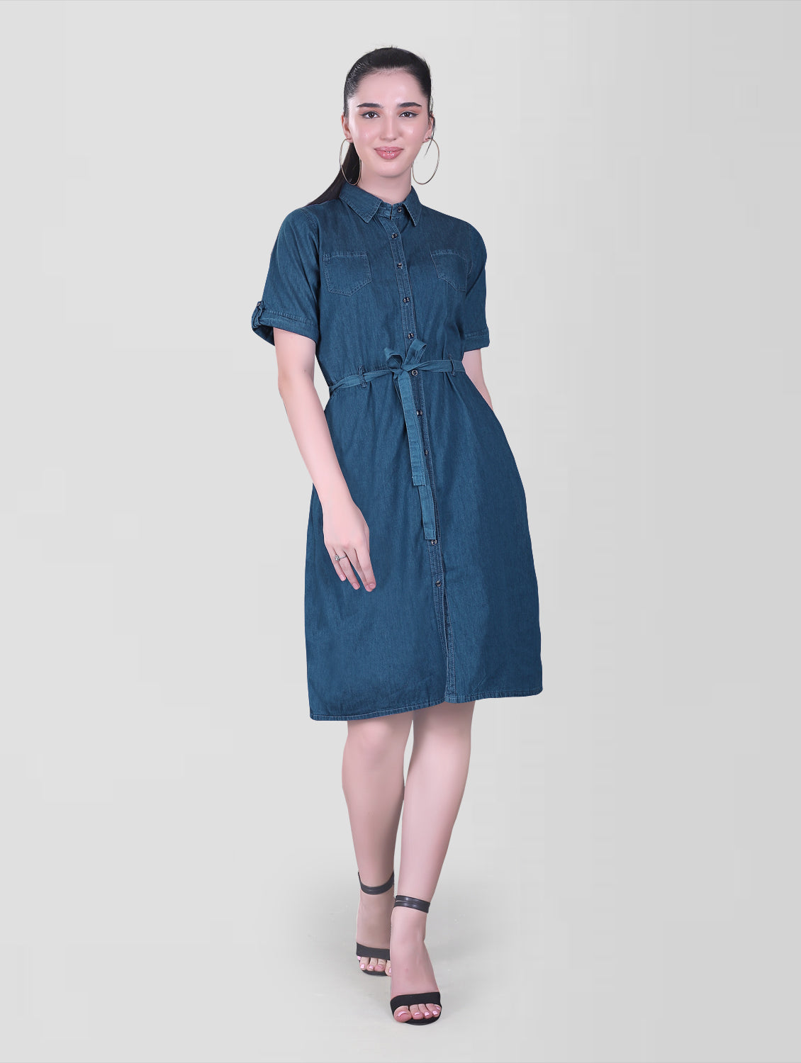 Detail shot of the Cefalu Women’s Blue Denim Dress focusing on the half sleeves with luppi and the two side pockets. The shirt collar and soft blue denim fabric are also visible.