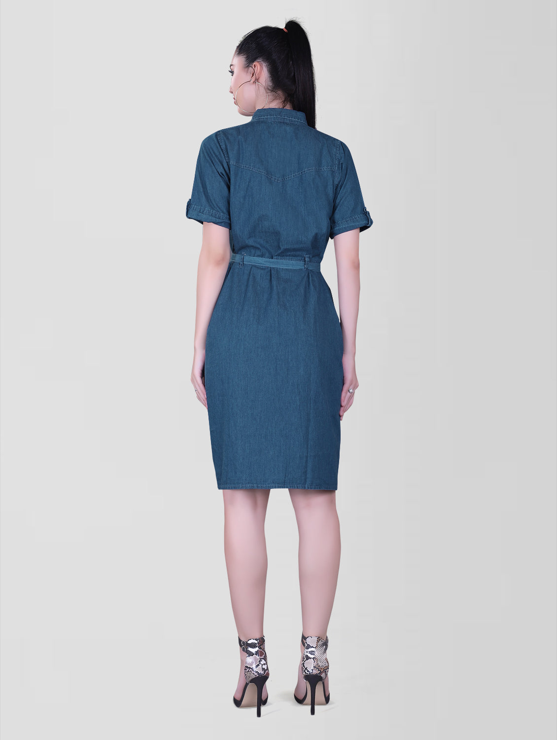 Back view of the Cefalu Women’s Blue Denim Dress featuring the A-line cut and shirt collar. The blue denim fabric and half sleeves with luppi are clearly visible.