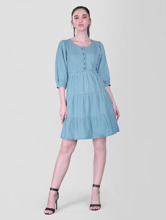 Cefalu Women’s Light Blue Denim Dress - Full front view showcasing fit and flare design with 3/4 puff sleeves and belt.