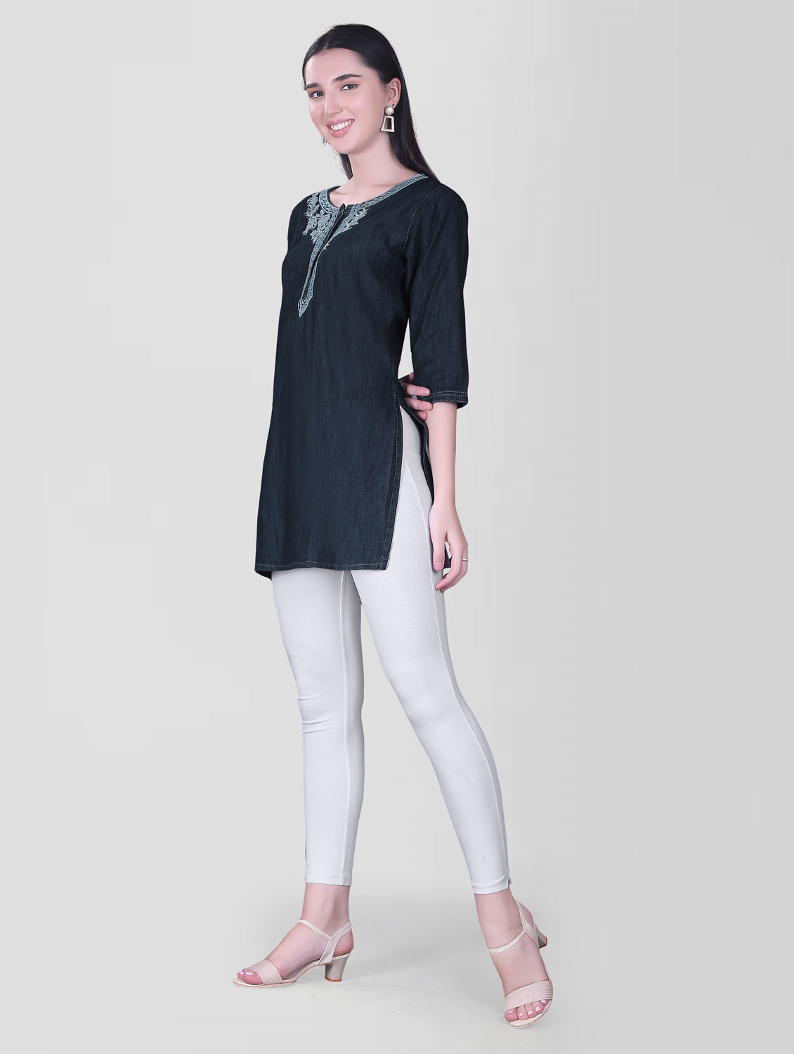 Full model view of Cefalu®️ Women's Dark Blue Denim Kurti, displaying the elegant round neck, blue embroidery, and flattering knee-length fit.