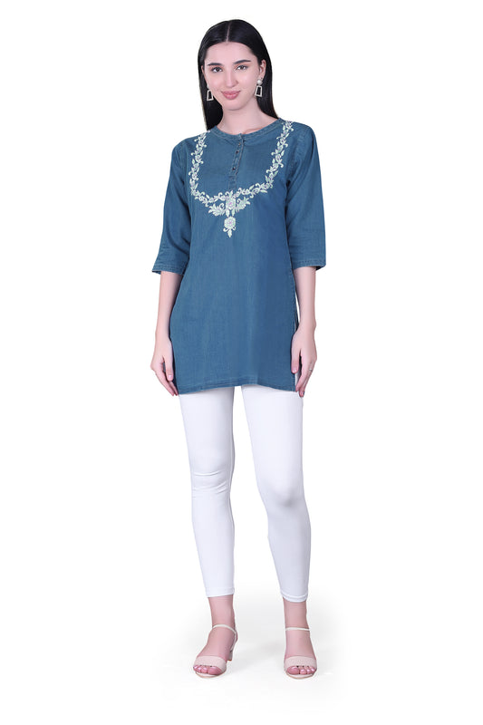 Model in a casual setting wearing Cefalu Women’s Blue Denim Kurti, showcasing its stylish and versatile design.