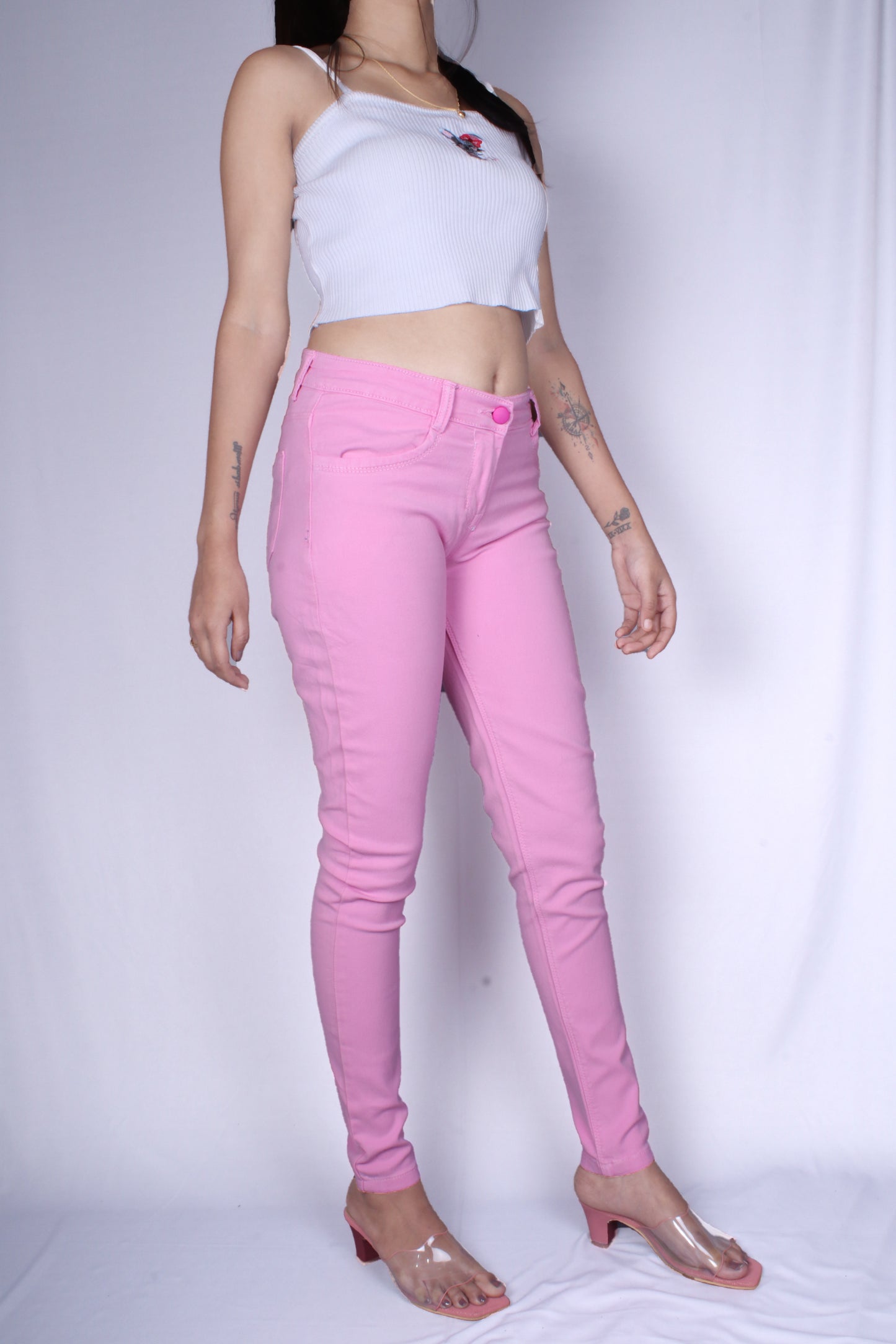 Right side view of Cefalu®️ Women’s Pink Slim Fit Jeans, showcasing the front pockets and mild wash.