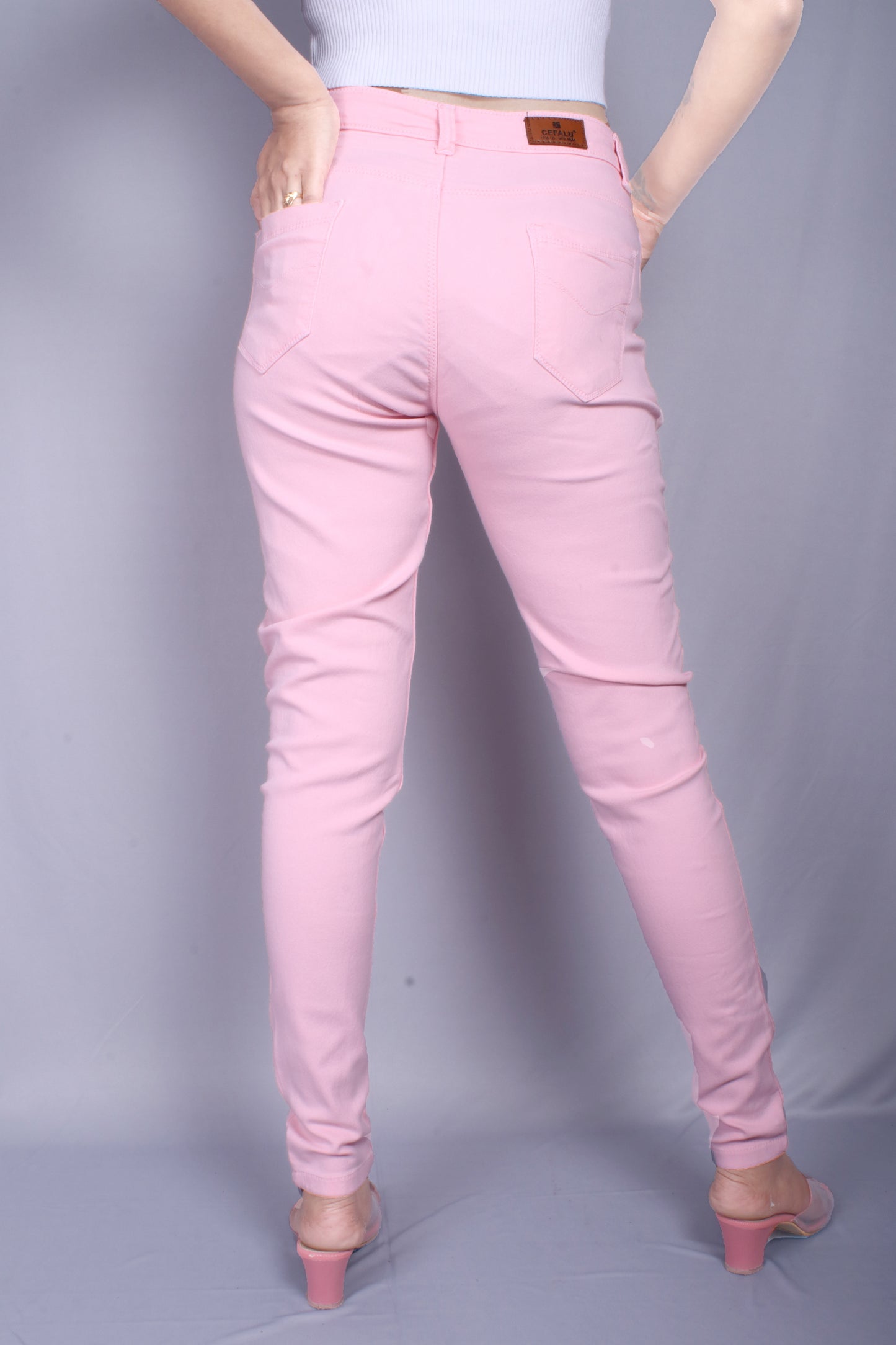 Back view of Cefalu®️ Women’s Peach Slim Fit Jeans, featuring the comfortable back pockets and mid-rise fit.