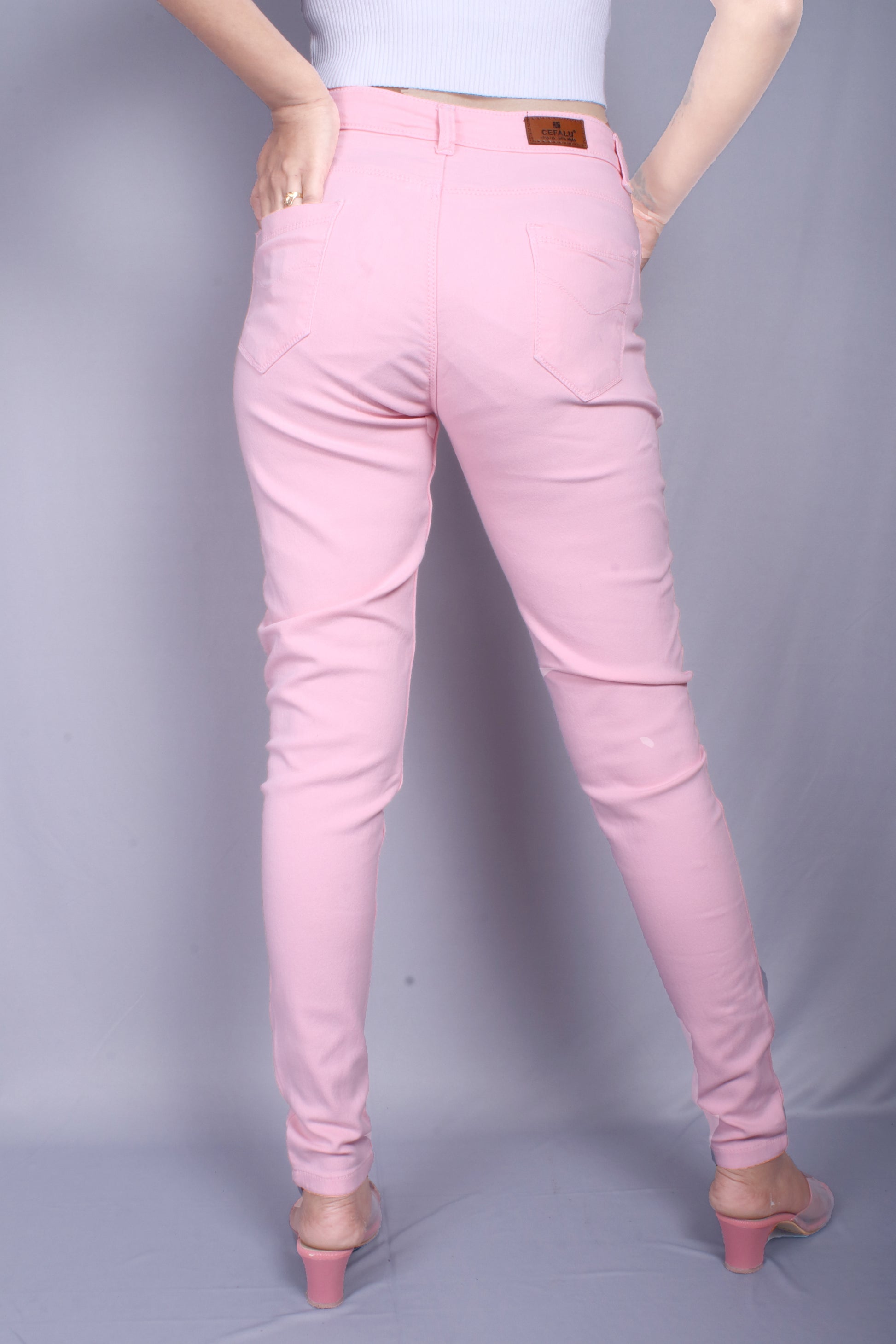 Back view of Cefalu®️ Women’s Peach Slim Fit Jeans, featuring the comfortable back pockets and mid-rise fit.