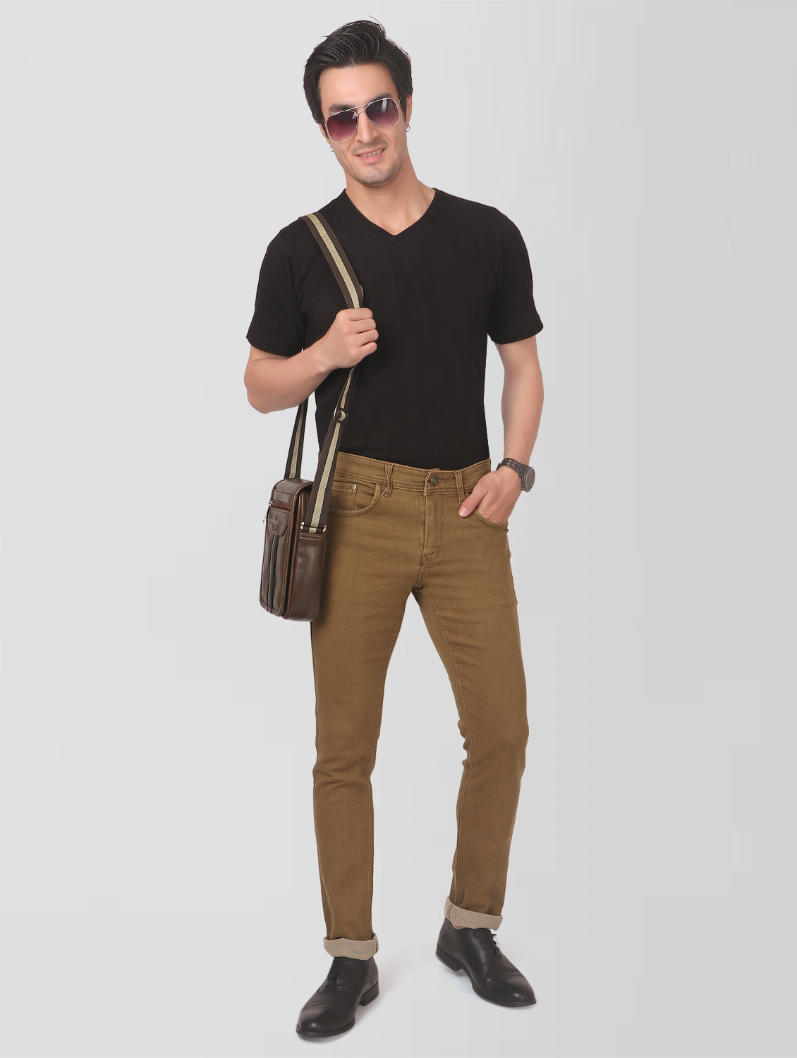 Model wearing TCI Men’s Golden Brown Slim Fit Jeans – showcasing the fit and style from a full-body perspective.