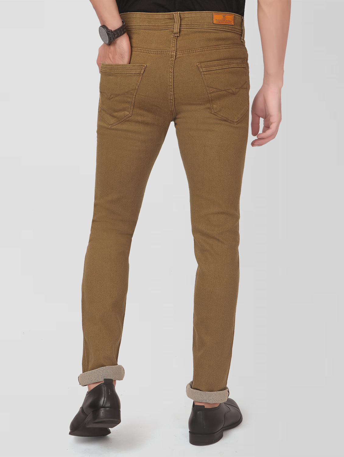 TCI Men’s Golden Brown Slim Fit Jeans – Back view highlighting the brand patch on the waistband and the 5-pocket design.