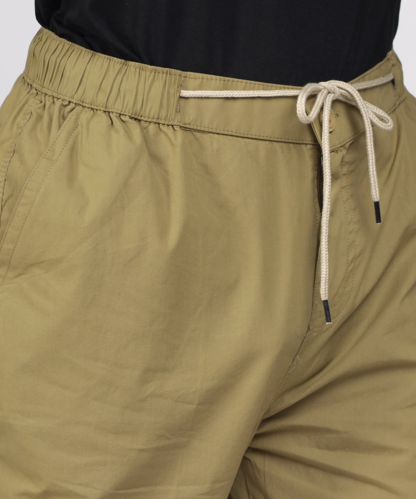 Detail of fine cotton fabric in khaki color.