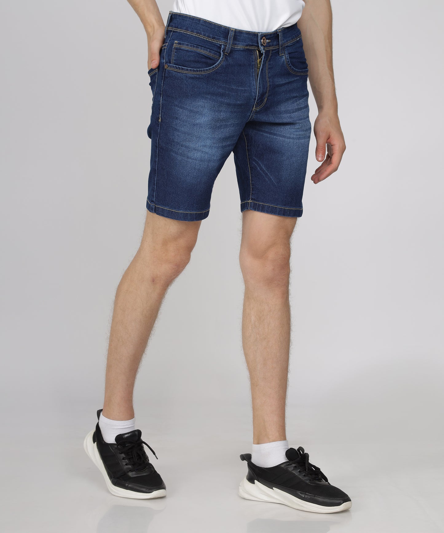 Knee length design of TCI Men’s Mid Blue Denim Shorts.