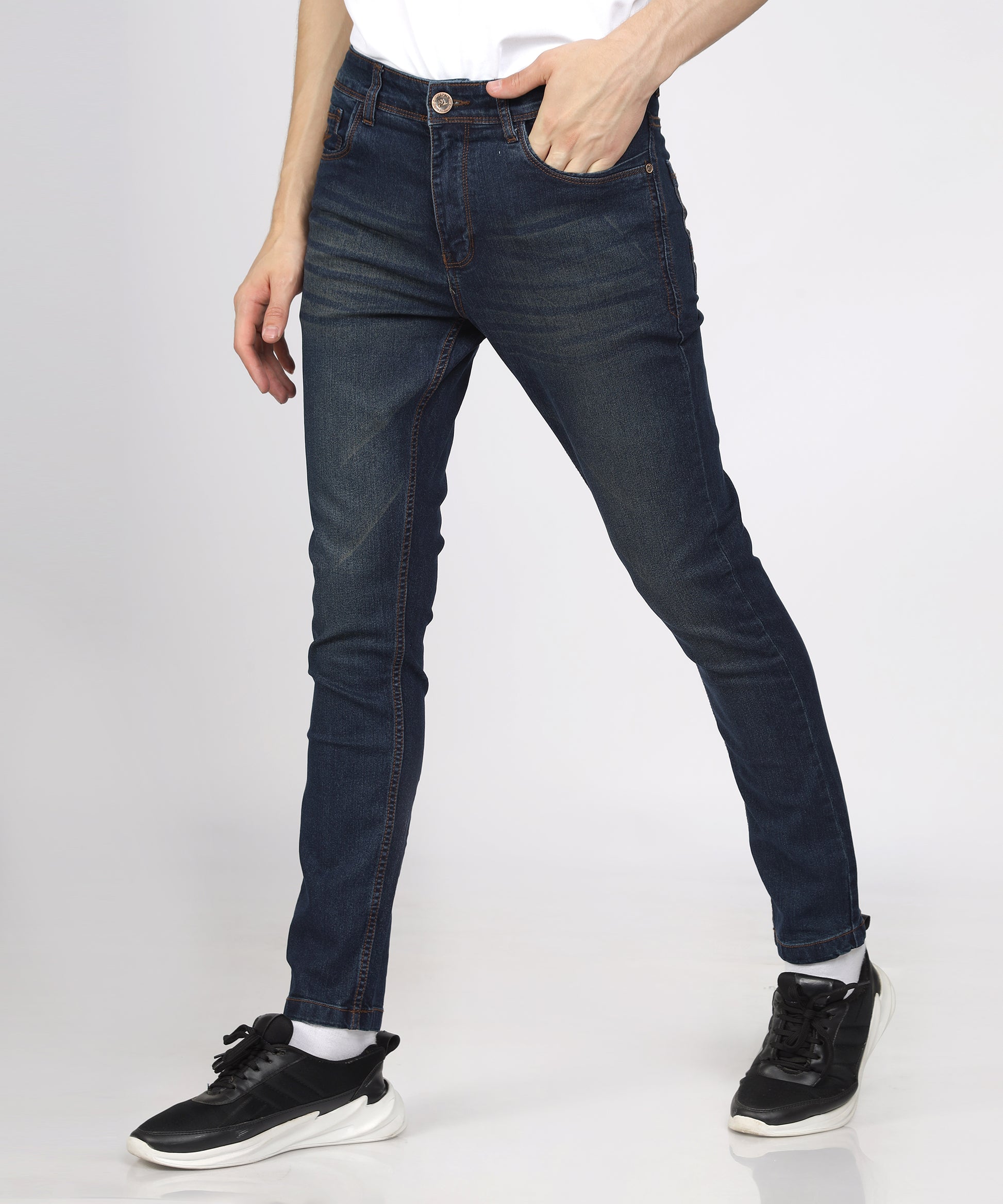 Fabric texture of TCI Men’s Corbon Blue Slim Fit Jeans highlighting stretchability.