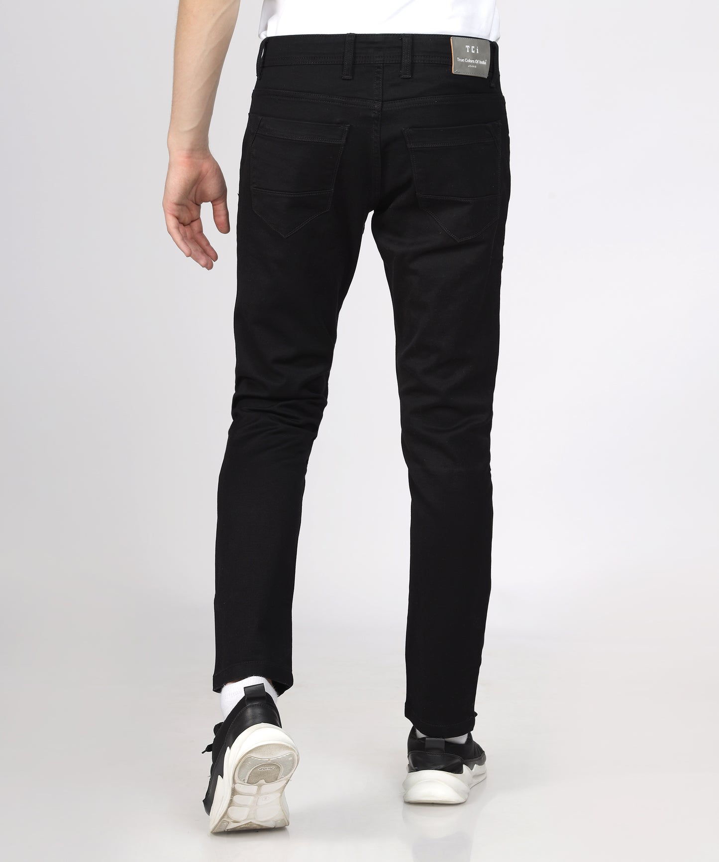 Back view of TCI Men’s Black Regular Fit Trousers displayed.